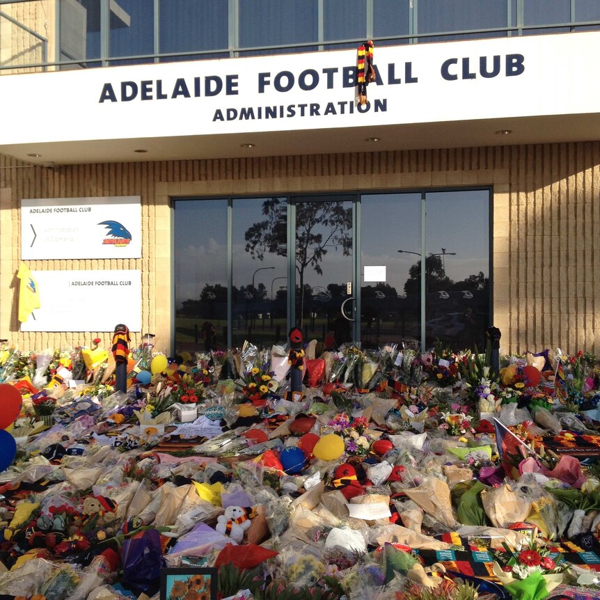 Flowers and tributes left outside the Crows headquarters