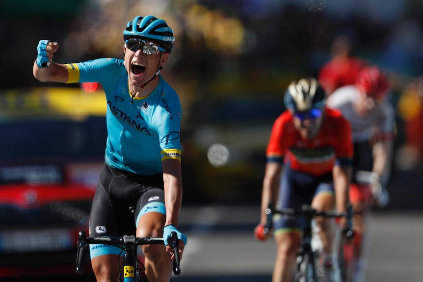 Denmark's Magnus Cort Nielsen celebrates as he crosses the line to win Tour de France stage 15.