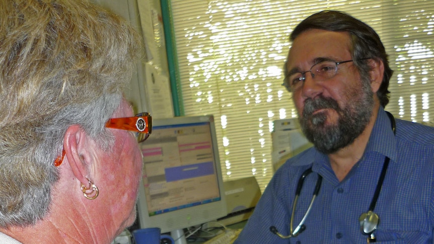 Doctor Chater talks to a patient