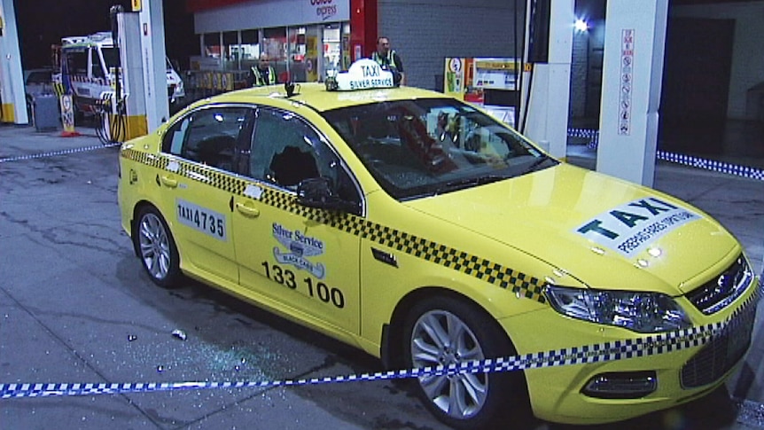 A taxi damaged in an unprovoked attack at a Spotswood service station