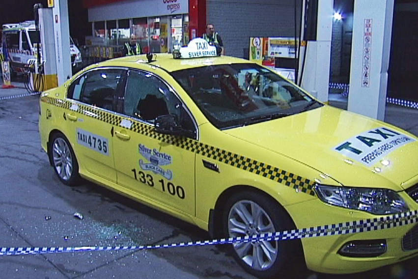 A taxi damaged in an unprovoked attack at a Spotswood service station