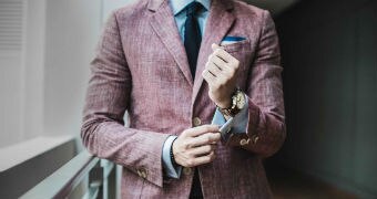 Close up of man wearing a suit.