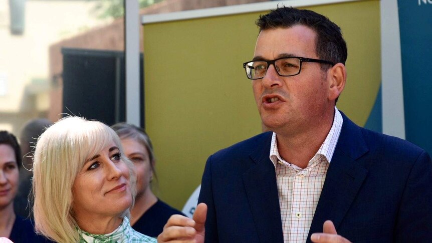 Daniel Andrews speaks to reporters in Wangaratta with his wife Catherine by his side.