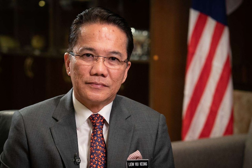 Malaysia's Law Minister Liew Vui Keong stares at the camera in a close-up portrait.