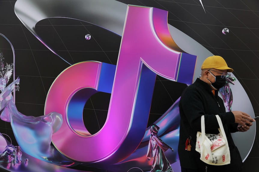 A man stands next to a ByteDance sign.