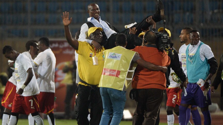 Ghana's coach James Kwasi Appiah celebrates with his team after Ghana qualified for the World Cup.