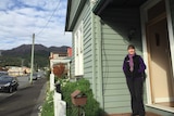 Joy Chappell in front of her Bed and Breakfast building