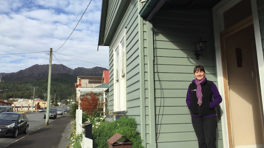 Joy Chappell in front of her Bed and Breakfast building