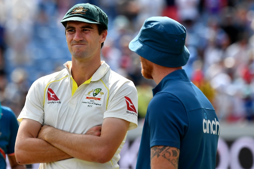 Pat Cummins pulls a face of frustration while standing next to Ben Stokes