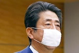 Japanese Prime Minister Shinzo Abe wearing a face mask