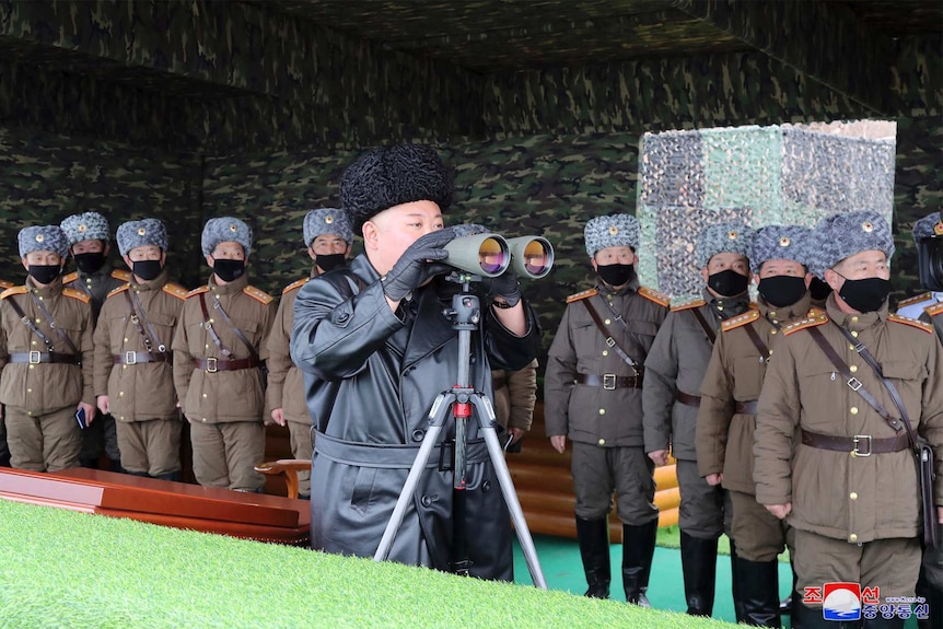North Korean leader Kim Jong Un, center, inspects the military drill of units of the Korean People's Army.