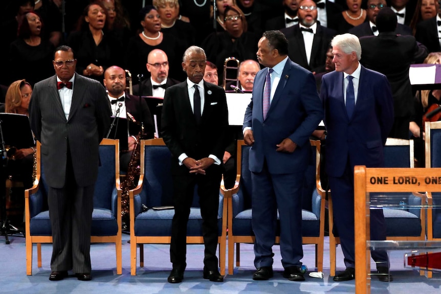 Louis Farrakhan, Al Sharpton, Jesse Jackson and Bill Clinton attend the funeral service.