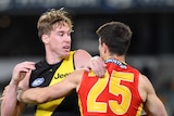 Tom Lynch puts his hands across the shoulders of Sam Collins as the pair face each other