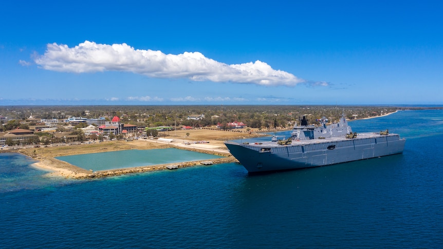 The HMAS Adelaide docked at a port in Tonga