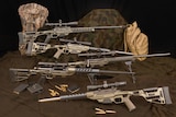 A display for rifles, bullets and camouflage equipment.