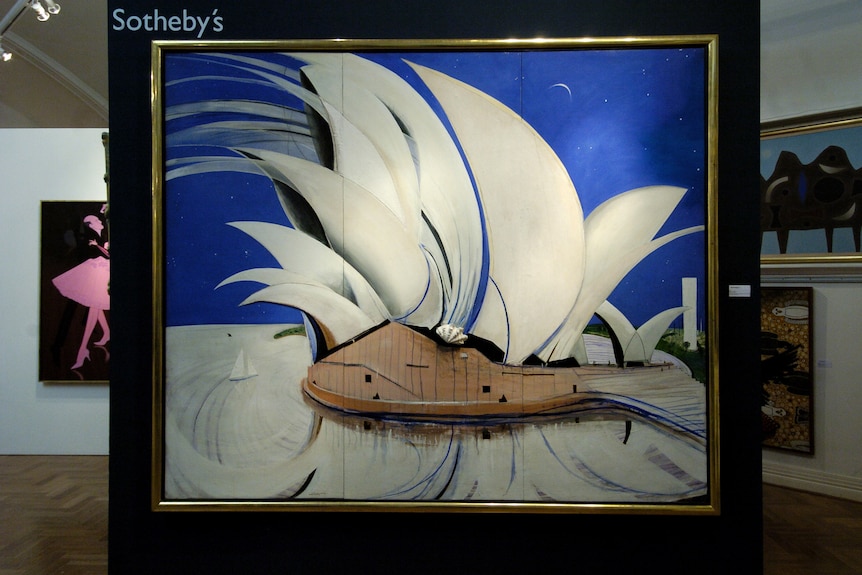 A painting of the Sydney Opera House hung on a wall with the Sotheby's logo on the top left.