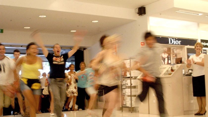 Crowds run into a Brisbane department store searching for bargains