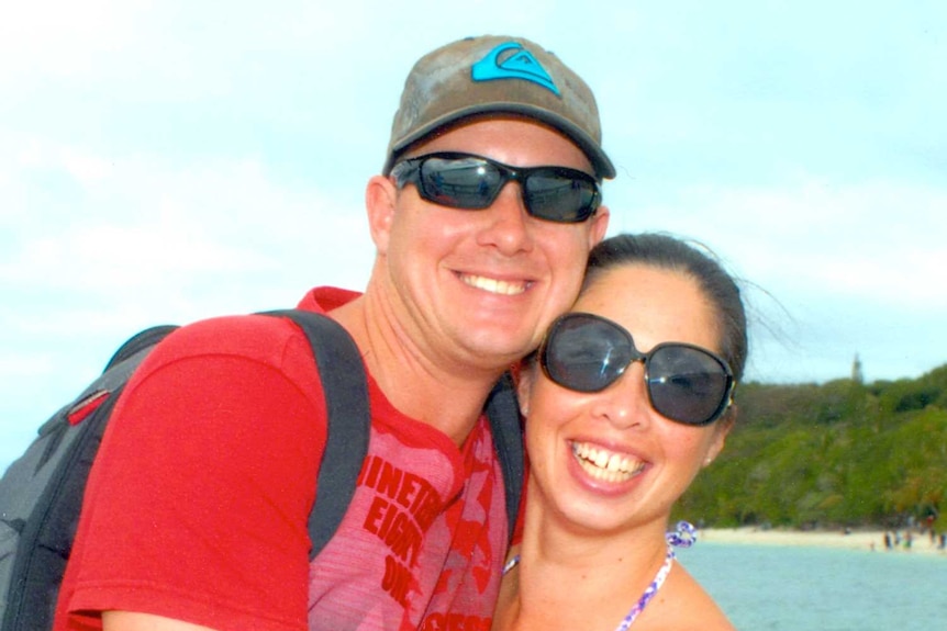 Leesa and Jamie hugging on a pier