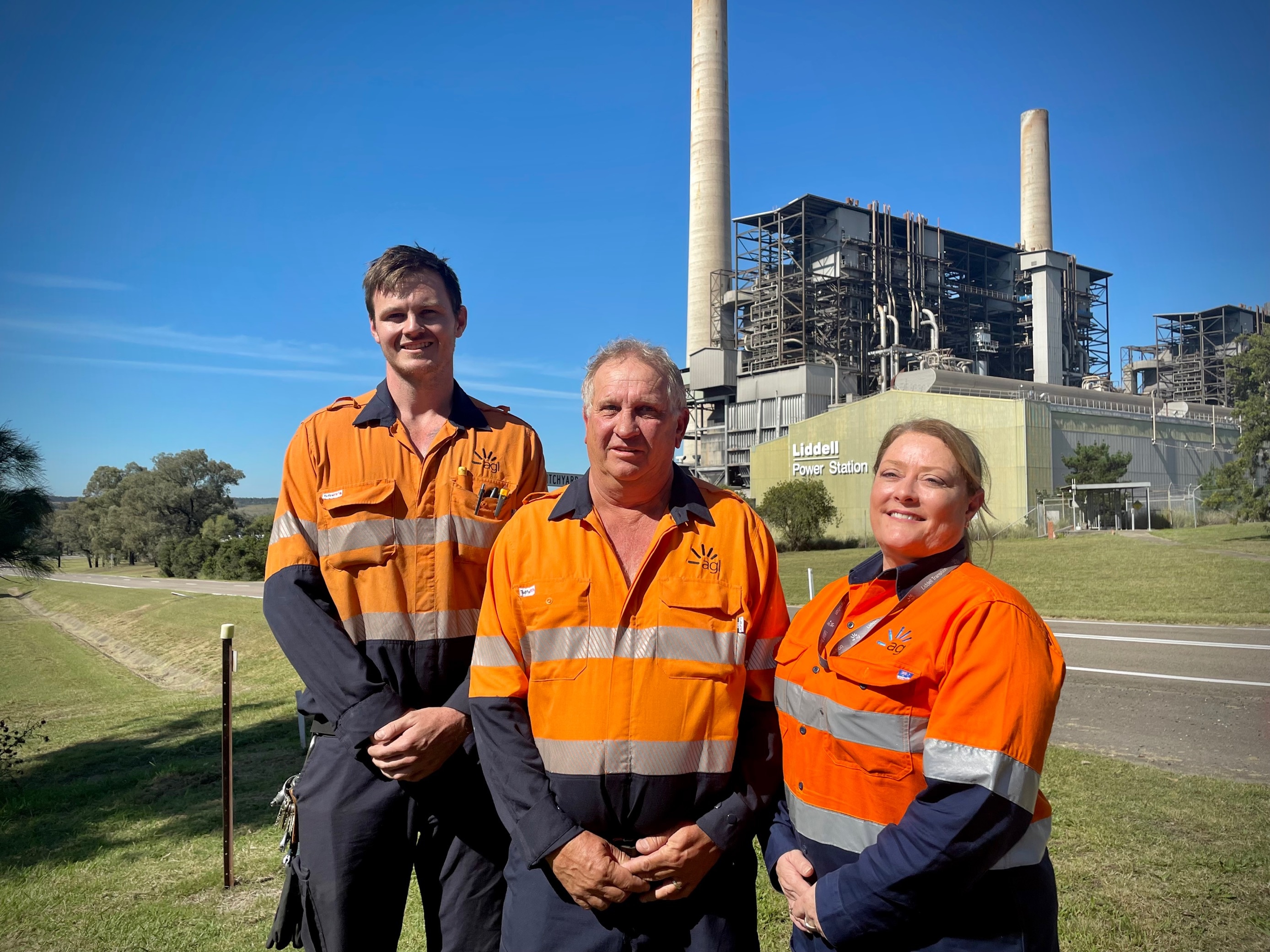 Three workers out the front of Liddell Power Station 