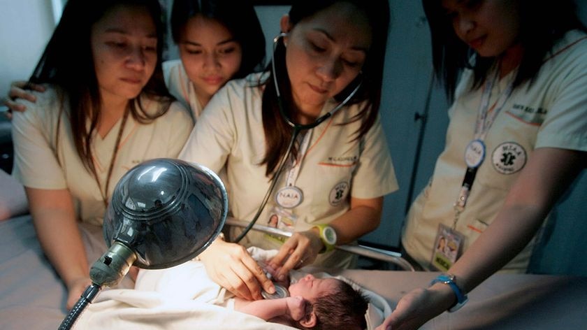 Ninoy Aquino International Airport doctors tend to a newborn boy found by aircraft cleaners