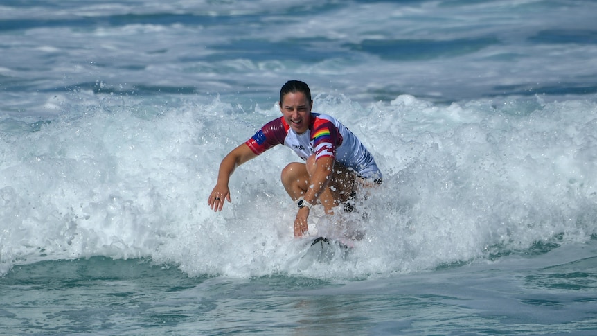 A woman on a surfboard in the water