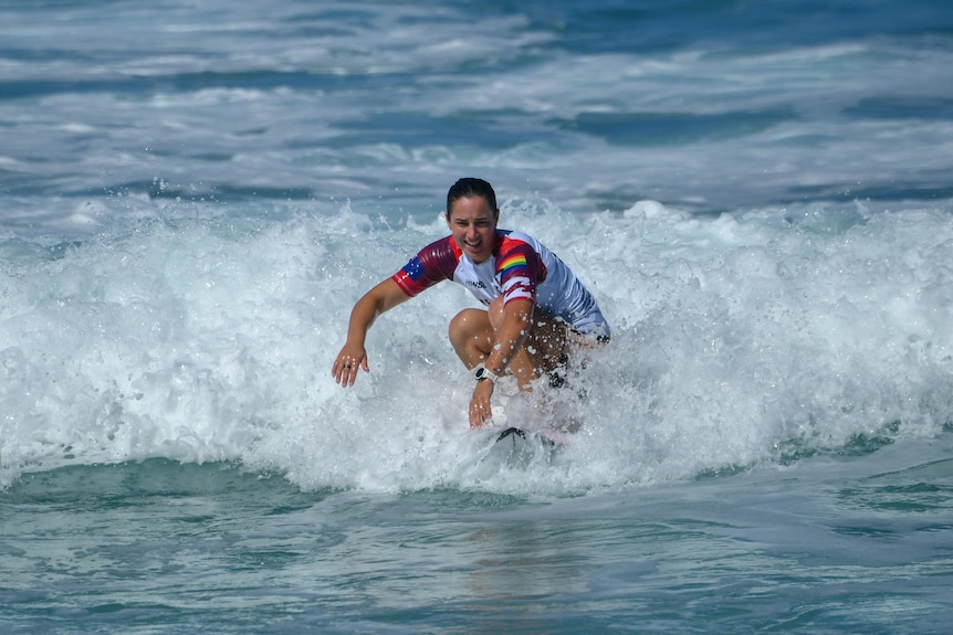 A woman on a surfboard in the water