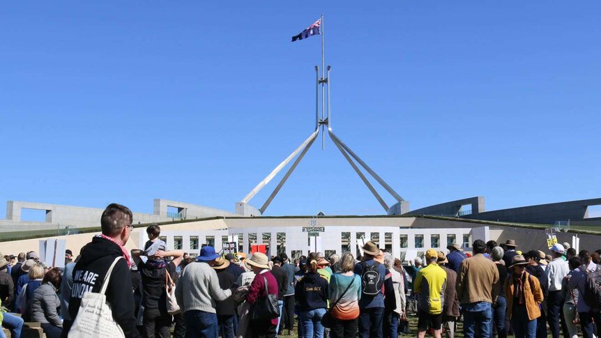Hundreds rally outside Parliament House.