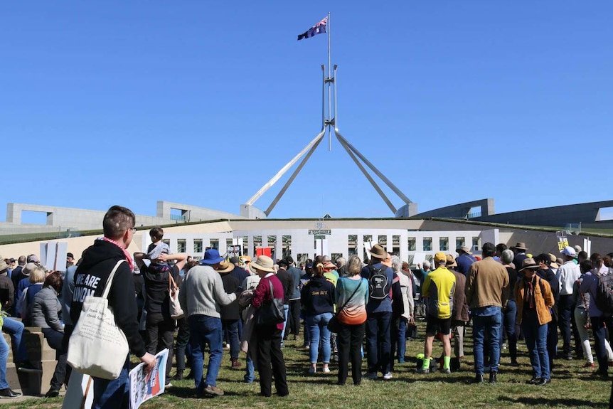 Hundreds rally outside Parliament House