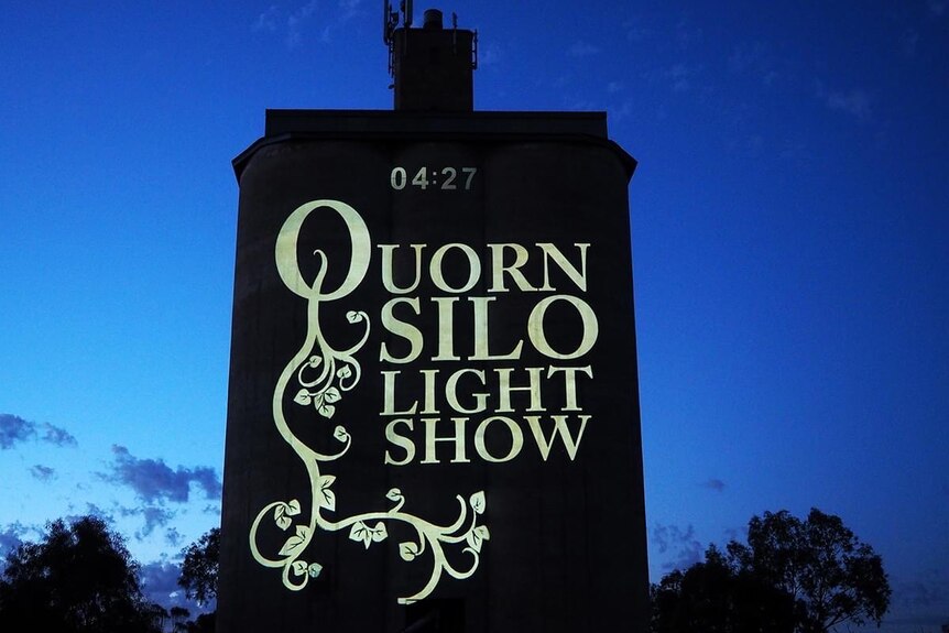 A silo with the writing Quorn Silo Light Show on it.