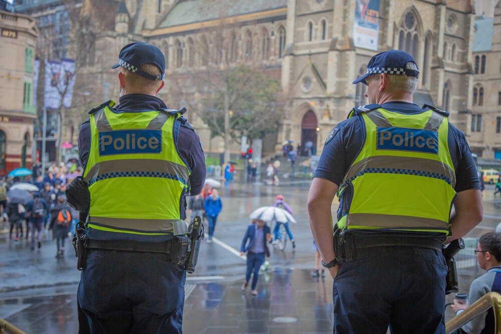 Two police officers at Flinders Street Station in Melbourne.