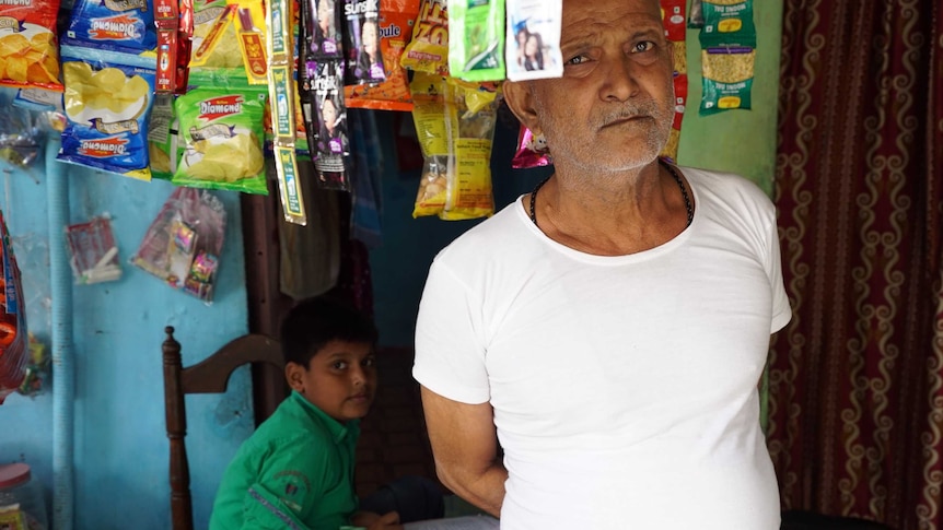 Mohommad Ali Khan and son at their store in Dharavi slum