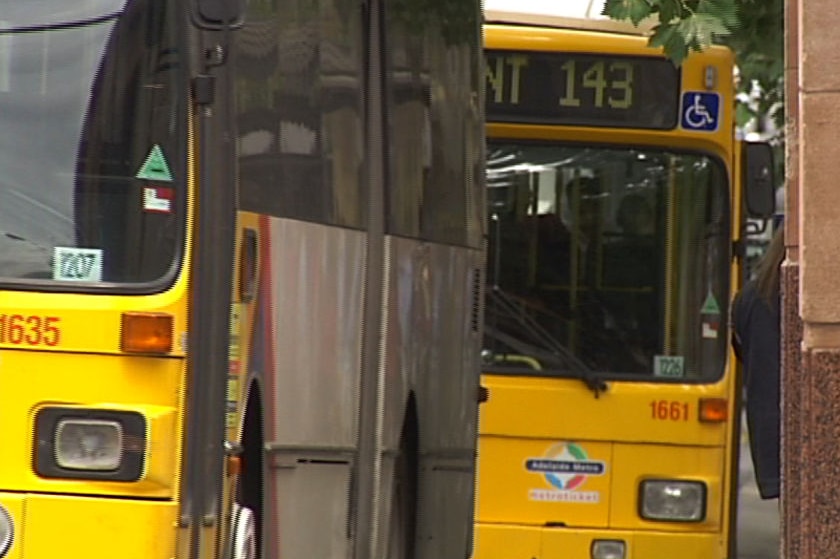 Two buses on a street.