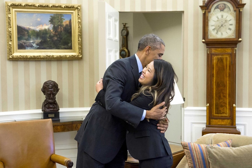 US president Barack Obama hugs Dallas nurse Nina Pham