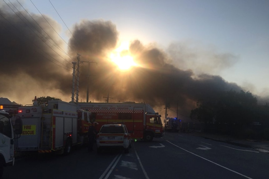 Smoke billows into the sky at  a factory fire in Brisbane's north.