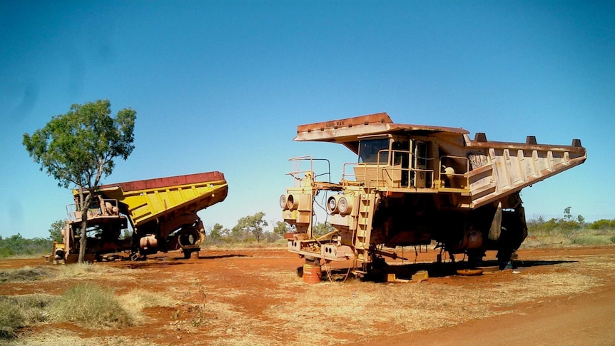 Abandoned mining trucks left on the roadside between Cloncurry and Mount Isa in Queensland.