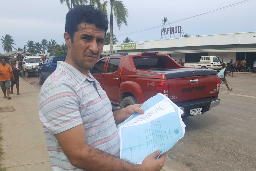 Benham Satah with his removal notices