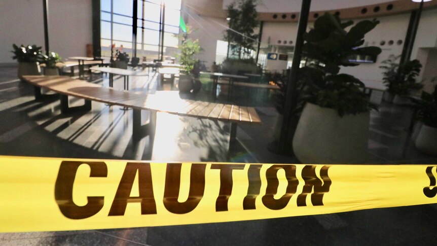 Photo of caution tape blocking off a dining area.