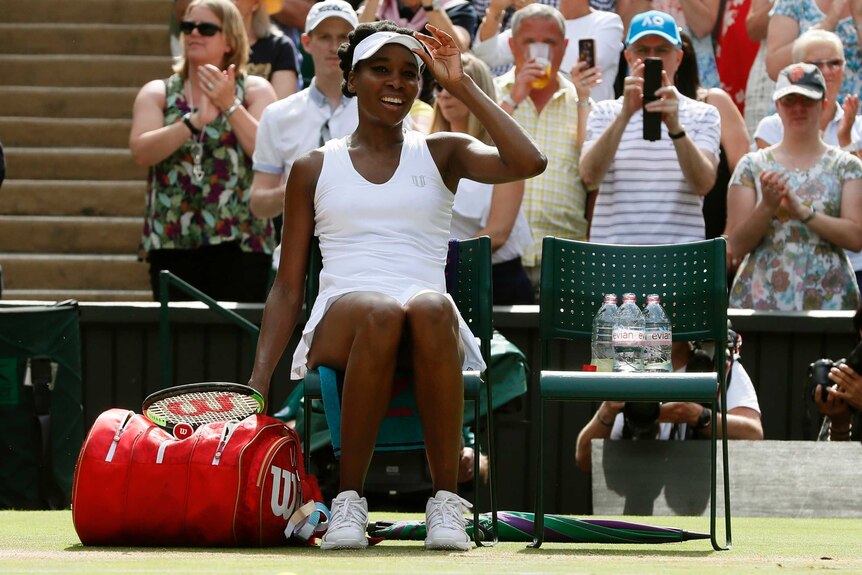 Venus Williams of the United States smiles after beating Britain's Johanna Konta at Wimbledon.