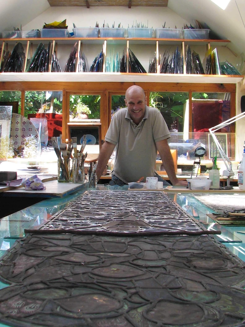 Gavin Merrington working on a window