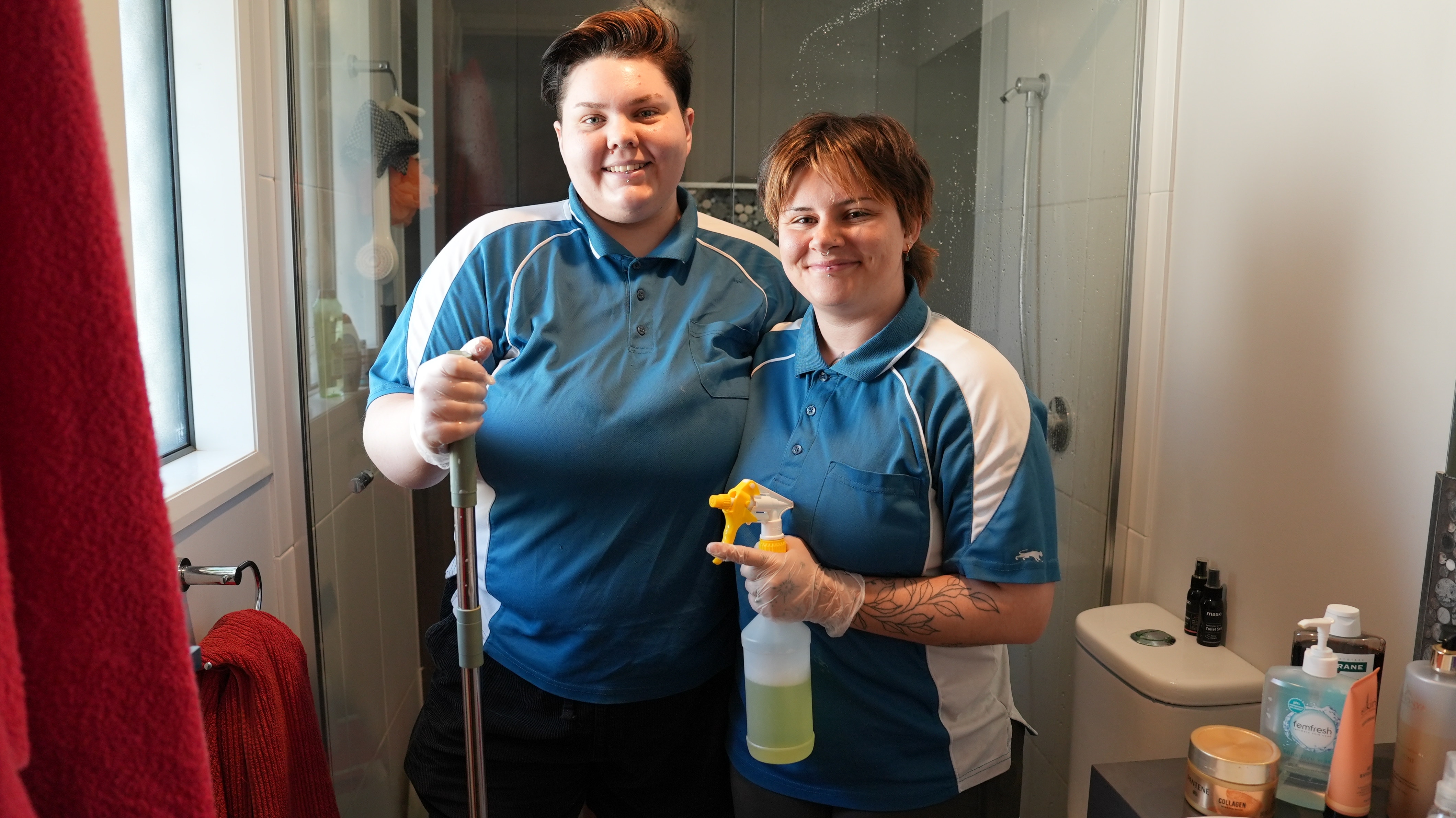 women cleaning bathroom