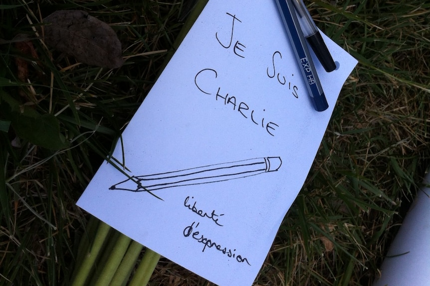 Offering of flowers and lead pencils to remember victims