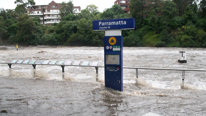 The Parramatta River surges past Parramatta Wharf after torrential rain the days preceding.