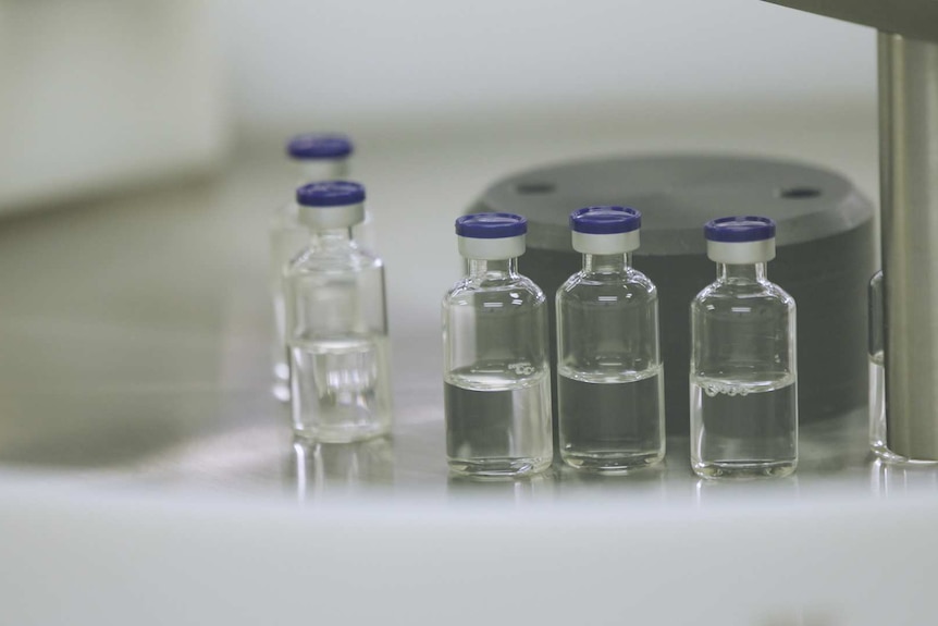 Glass vials filled with clear liquid