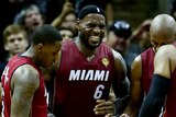 Miami Heat's LeBron James grimaces as he cramps up in the final quarter of NBA Finals game one against San Antonio Spurs