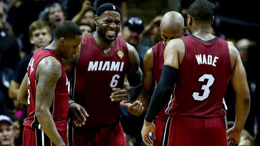 Miami's LeBron James grimaces after cramping up in game one of the NBA Finals against San Antonio.