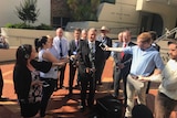 The Tamworth Mayor Col Murray, surrounded by councillors, addresses a press conference in Tamworth.