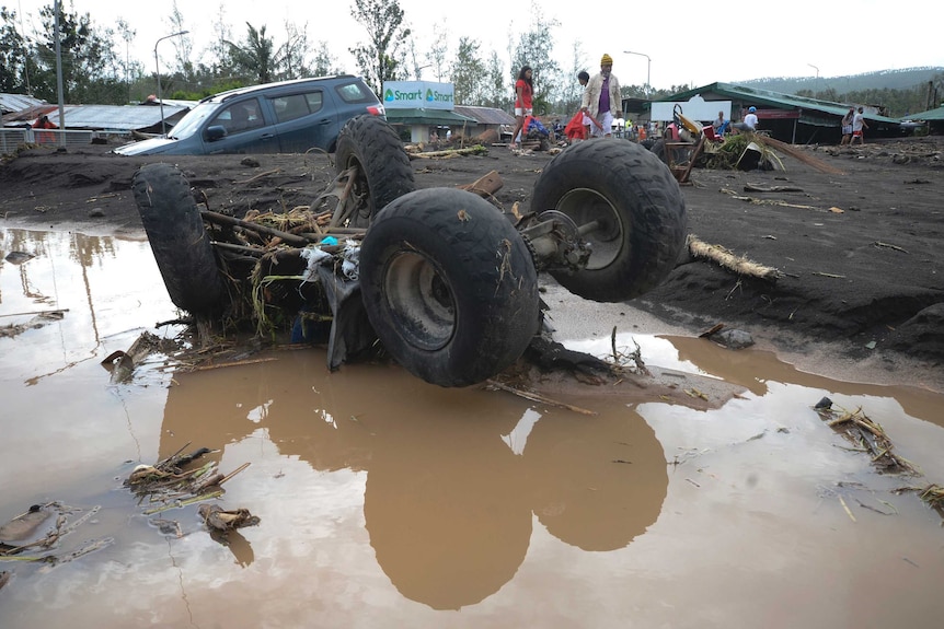 An all-terrain vehicle overturned by strong winds and floods from Typhoon Goni.
