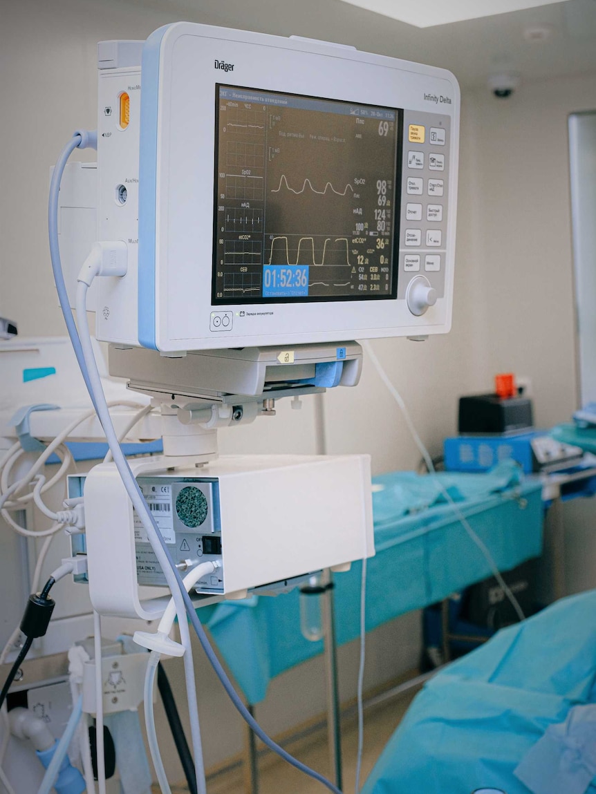 Electrocardiogram monitor in hospital ward.