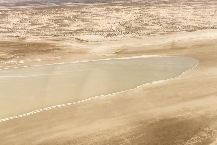 A parched outback landscape fills with water.