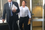 Former Queensland detective Mick Featherstone leaves the Brisbane watch house on Friday afternoon.